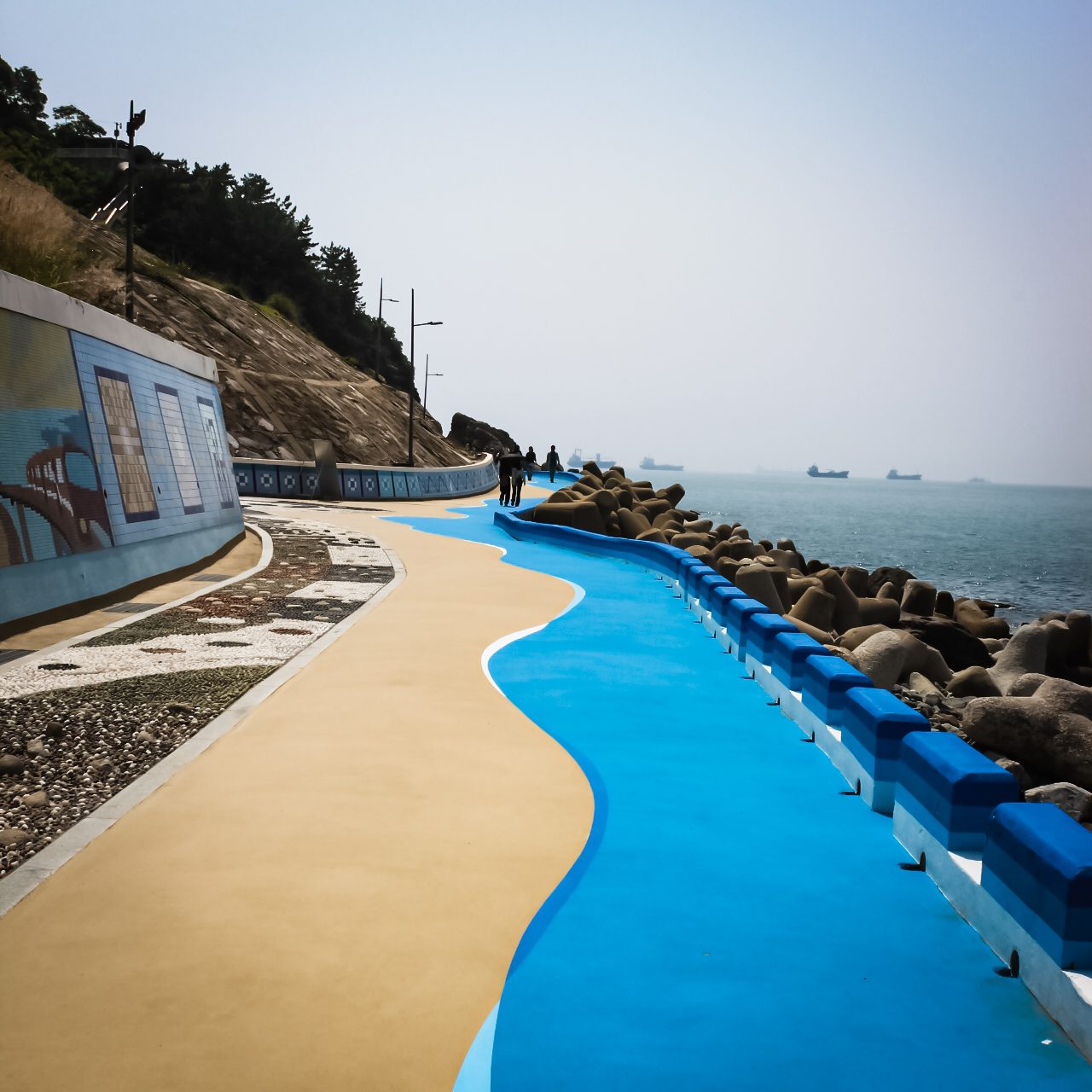 Blue coastal walkway along the sea in Busan